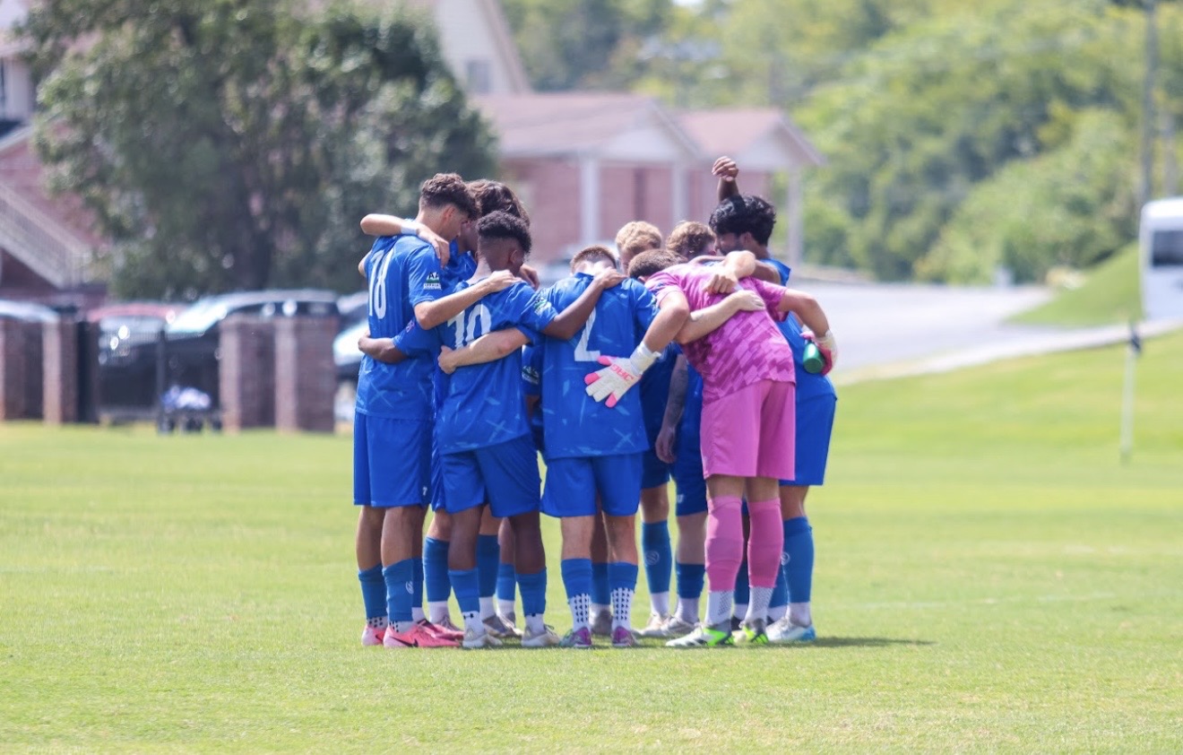 Football team huddle before a match